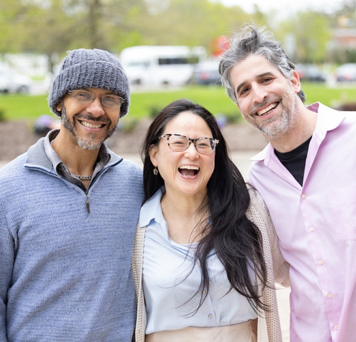 Three smiling faculty members