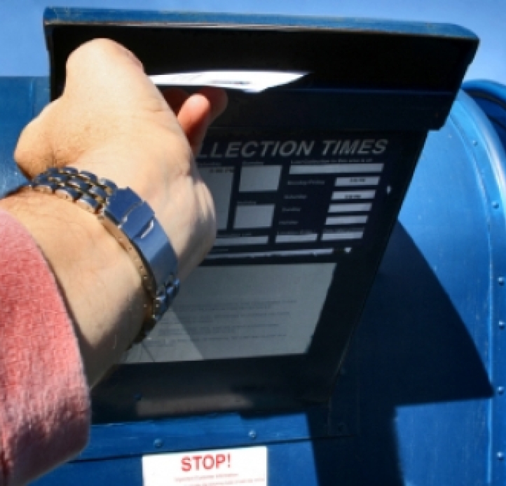 Person mailing an envelope