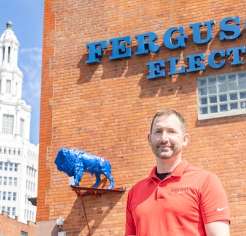 Person standing outside Ferguson Electric building